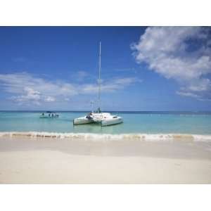 Bay Islands, Roatan, West Bay, Man Reading Book on Catamaran, Honduras 