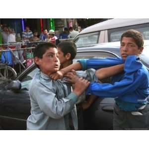  Two Afghan Children Who are Making Car Washing Work Fight 