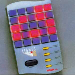  Lights Out Handheld Electronic Game (1995): Toys & Games