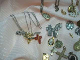 assortment lot of religious medals crosses rosary beads  
