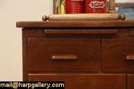 paneled in oak with a maple butcher block top an antique store counter 